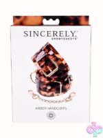 Adjustable brown tortoiseshell-inspired handcuffs with gold-plated accents by Sportsheets