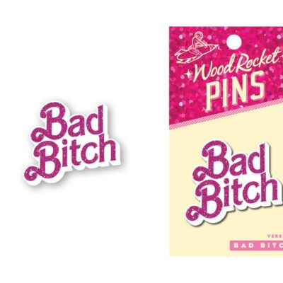 Purple metal enamel lapel pin with pink glitter lettering by Wood Rocket