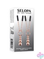 Rose gold beaded nipple clamps with hanging beads and rubber tips by Selopa