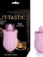 Rose-shaped clit licker toy in pink silicone with tongue-shaped stimulator tip on soft background