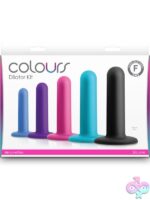 Five graduated multicolor silicone dilators laid out by size by Ns Novelties