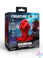 Medium red and black dragon egg silicone butt plug with twisted ridges by Creature Cocks