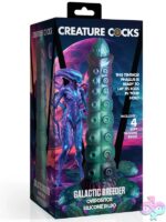 Iridescent teal-red-blue ovipositor dildo with silicone eggs and engraved shaft by Creature Cocks