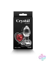 Crystal Desires Red Heart borosilicate glass anal plug in clear with red heart detail, shown in small and medium sizes