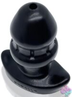 Large black flow-thru silicone plug with double-seal design and center vent channel by Oxballs