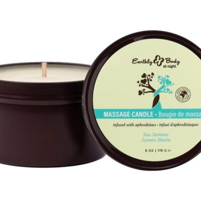 White 6 oz sea jasmine aphrodisiac candle from Earthly Body At Night Collection on a romantic nightstand