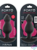 Pointee large silicone anal plug in black and red on a neutral background
