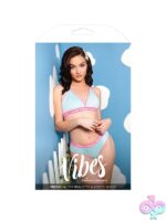 Light blue halter bralette and booty short set with criss-cross straps and embroidered daisy patch