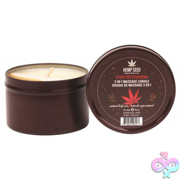 Romantic candles and a melting massage candle glowing on a nightstand for a couples date night