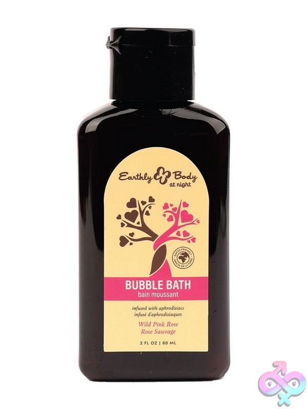 Couples bath body collection with sensual soaps, bath salts, and massage lotion arranged on a folded towel