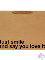 Large red humorous gift bag by Wood Rocket with bold printed text, shown standing upright