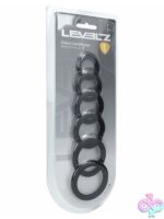 Six-piece graduated black silicone cock ring set by Shots Toys displayed in clamshell packaging
