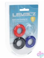 Four-piece multi-color stretchy TPE cock ring set by Shots Toys displayed in clamshell packaging