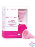 Pink collapsible menstrual cup Size A folded flat in compact case by Intimina