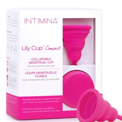 Pink collapsible menstrual cup folded flat by Intimina