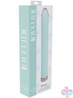 Loveline Sparkle 6.3 inch glass vibrator in blue pink and yellow on a soft neutral background