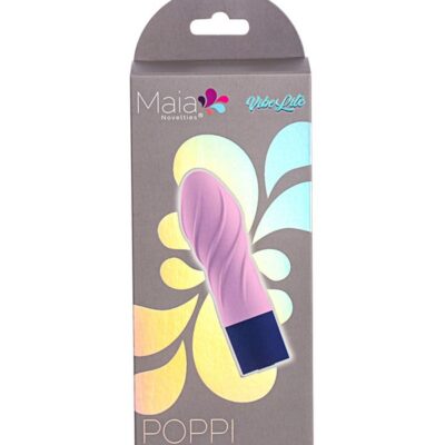 Compact pink silicone clitoral vibrator Poppi by Maia Toys shown beside its magnetic charging cable