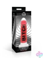Bold red ribbed silicone dildo with suction cup base and harness-compatible design by Master Series