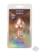Gold gem base metal anal plug by Camtoyz, tapered conical design on a neutral background