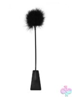 Ouch! leather feather crop in black and red on a dark background