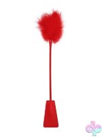 Ouch! leather feather crop in black and red on a dark background