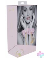 Pink bonded leather handcuffs with iridescent metal hardware by Shots Toys