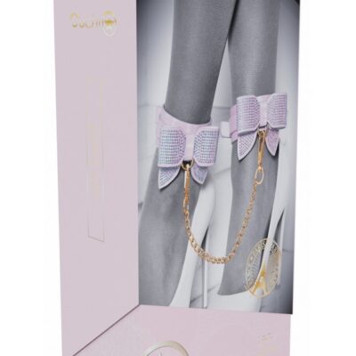 Adjustable pink bonded leather leg cuffs with iridescent metal hardware by Shots Toys