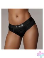 Black high-cut vibrating strap-on brief in size M/L by Shots Toys, shown flat against neutral background
