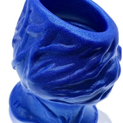 Large hollow silicone plug in blue morph finish by Oxballs, showing veiny outer texture and open hollow core