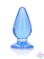 Realrock Crystal Clear 3.5 inch anal plug with suction cup base in four colors on a clean white background