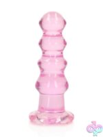 RealRock crystal clear curvy dildo and butt plug in blue, clear, and pink with suction cup base