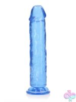 Realrock Crystal Clear straight realistic dildo with suction cup base shown in clear and blue variants