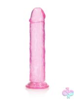 RealRock Crystal Clear 11 inch realistic dildo with suction cup base shown standing upright on white background
