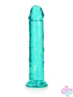RealRock Crystal Clear 11 inch realistic dildo with suction cup base shown standing upright on white background