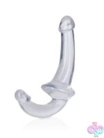 RealRock Crystal Clear Strapless Strap-On standing upright showing dual-ended design in four color options