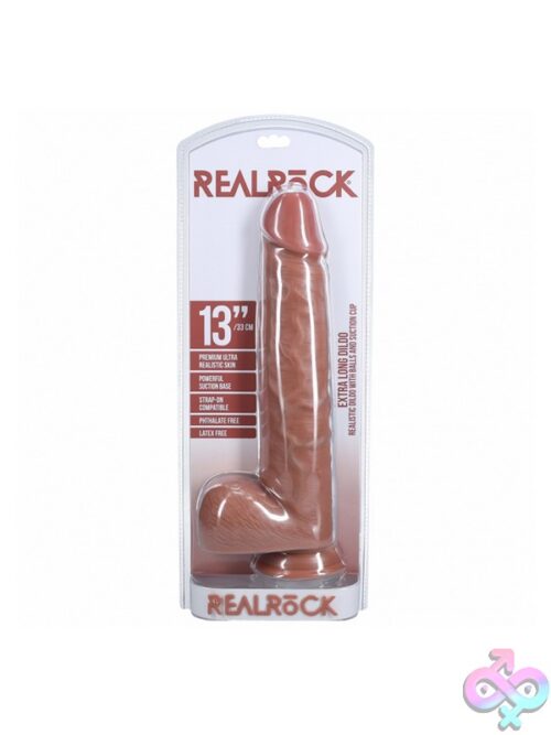 Realrock Extra Long Realistic Dildo With Balls 13 Inch Shown Upright Displaying Detailed Veining And Suction Cup Base