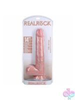 RealRock 14-inch extra long realistic dildo with balls in beige and pink on a neutral background