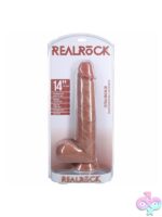 RealRock 14-inch extra long realistic dildo with balls in beige and pink on a neutral background