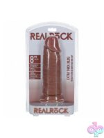 RealRock extra thick 8 inch realistic dildo with suction cup base shown upright on white background