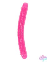 RealRock glow in the dark double dong 12 inch in neon green on a dark background