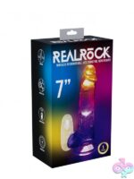 Clear 7-inch LED vibrating dildo with realistic texture and suction-cup base by Shots Toys