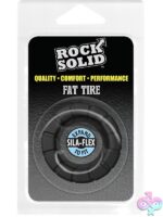 Textured black silicone cock ring with wide flat sides and rugged tread design by Rock Solid