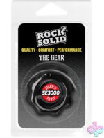 Rock Solid Gear cock ring in black and clear on a neutral background