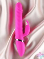 Ruby thrusting rabbit vibrator in pink silicone by Edonista, shown against a neutral background
