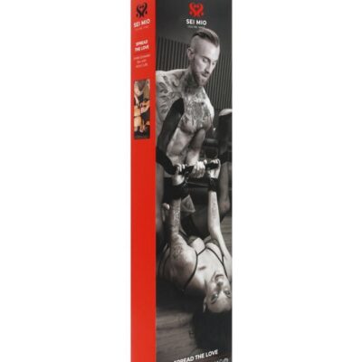 Black metal and polyester spreader bar with padded velvet wrist cuffs by Sei Mio
