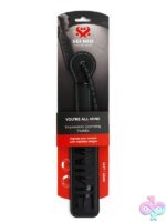 Black faux leather impression spanking paddle with MINE cut-out lettering and wrist loop by Sei Mio