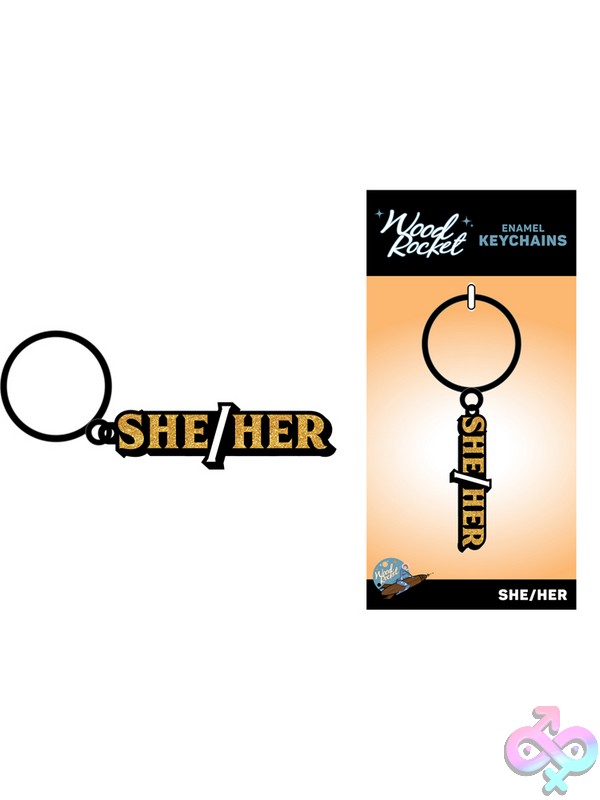 Discreet-Toys-She-Her-Keychain-Nu-Key-035 Glittery Gold She/Her Pronoun Enamel Keychain On Metal Ring By Wood Rocket