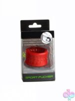 Sport Fucker Low Stack Ball Stretcher in blue, clear, and red TPE on neutral background