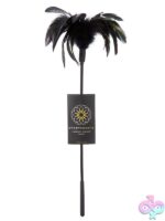 Starburst feather tickler wand in black and red on a dark sensual background
