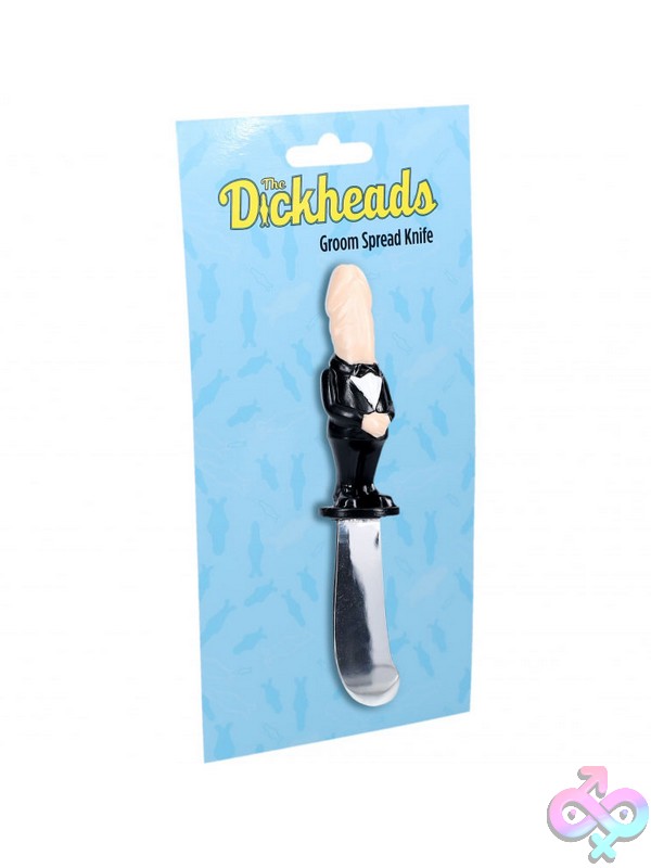 Discreet-Toys-The-Dickheads-Groom-Spread-Knife-Flesh-Nu-St-Sli249Fle Black Metal Groom-Themed Novelty Spreader Knife By Shots Toys Displayed On A Charcuterie Board